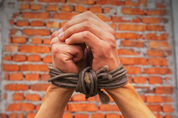 persons-hands-bound-at-the-wrist.jpg